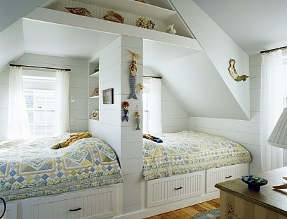 Two children's beds by the window
