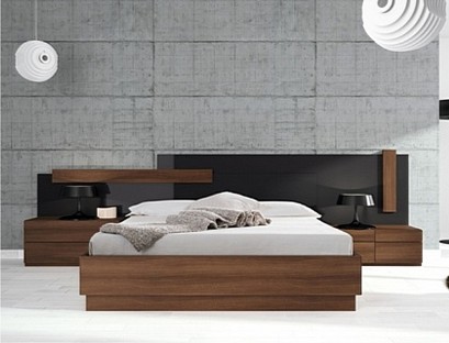 A beautiful bed with a glossy headboard